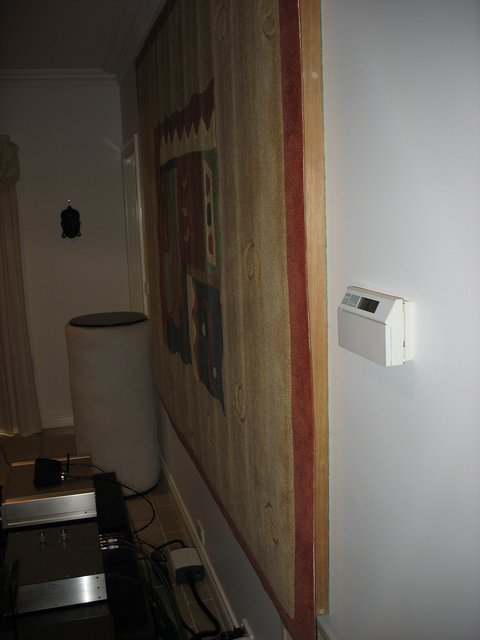 On the wall behind the speakers, a thick rug (7'6"w x 5'h) is mounted on a 3" deep frame that is filled with fibreglass for broadband absorption.