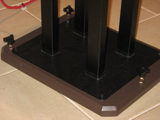 Speaker stand plinth. - Cut some brass threaded rod into 2.5" lengths, glued one end into knobs (come with brass thread inserts), ground other end into a point and fed through plinth into T-Nut fitted into bottom of plinth. These custom spikes enable the speakers to be levelled from above, with one hand. Three spikes per stand ensure no rocking.