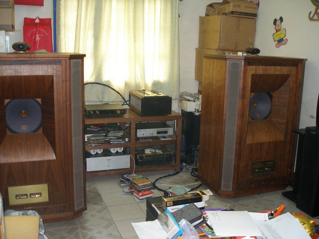 "Teacher Fong's Audio & Listening Room" - Teacher Fong's Tannoy Westminster Royals. When I suggested that he should move these to my home. He contered with, "If you can carry them out of here on your back, they are yours!!" I am almost dumb enough to try!!! Smile!!! Mr. Fongs "little amplifier" drives the "Royals" to unbeleiveable levels of pure music!!! Just pure magic!!! If only I could just get him to complete the battery operated pre-amplifier that he keeps upgrading and fiddling around with. I want one so bad for my self.