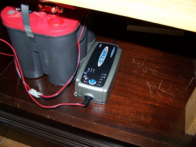 Battery and loader